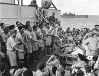 A fond farewell 'Always there was the singing', Members of B Company 28 Maori Battalion entertaining the other troops, Alexander Turnbull Librar