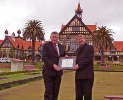 warren-with-lyall Warren Harford of the Agrodome is presented with a certificate of acknowledgment by Centennial Trust Chairman Lyall Thurston